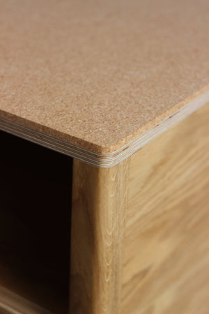 Handmade bedside table | bedside cabinet, perfect for a modern home. It features cork top with oak veneered plywood and solid oak legs. Made by Jon Grant London in Leyton, East London.