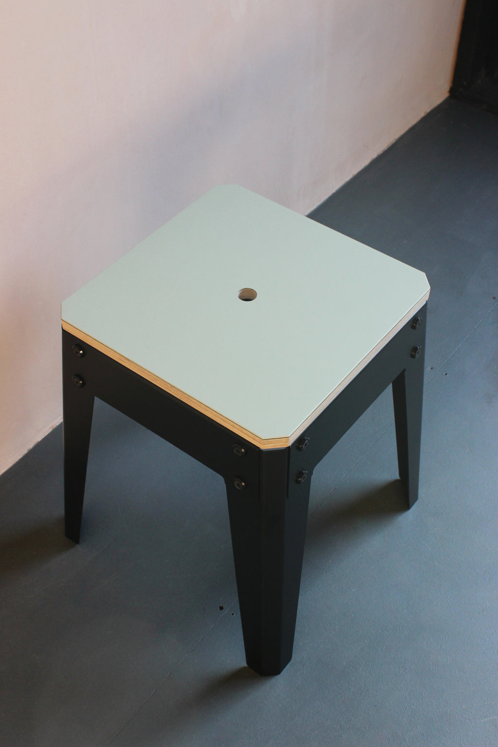 Our low stool is designed and made by Jon Grant London in Leyton, East London. It features metal powder coated legs with Forbo lino top.