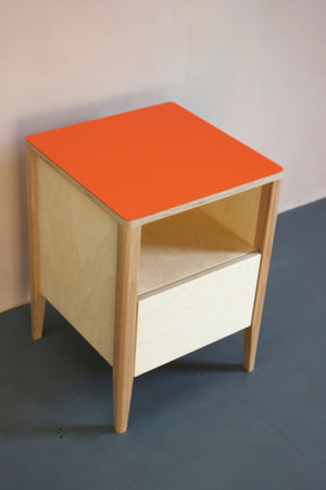 Handmade bedside table- perfect for a modern home. It features Forbo linoleum plywood  top with solid ash legs. Made by Jon Grant London in Leyton, East London.